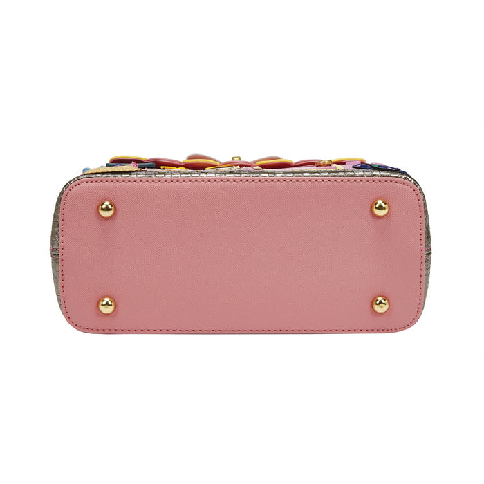 Pink handbag with gold accents on a white background