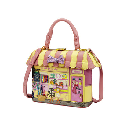 Handbag designed like a store with a pink and yellow color scheme on a white background
