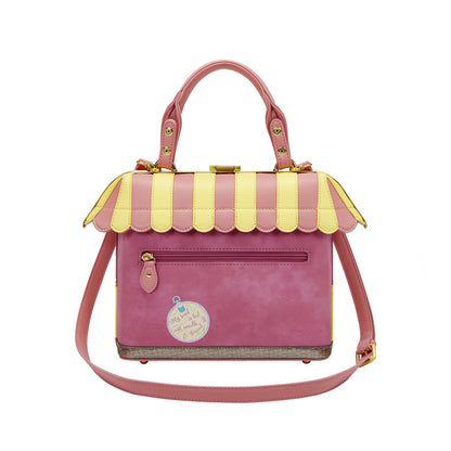 Pink handbag with yellow striped roof on a white background