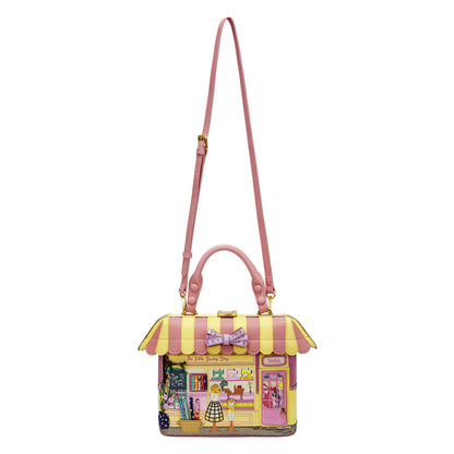 Pink and yellow handbag with a cartoon design on a white background