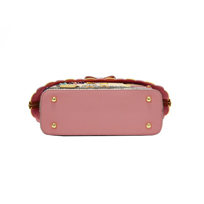 Pink handbag with gold accents on a white background
