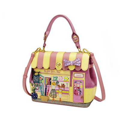 Handbag designed like a store with a pink and yellow color scheme on a white background