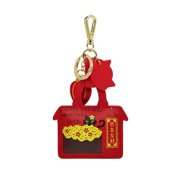 Red cat-shaped keychain with gold clasp on a white background