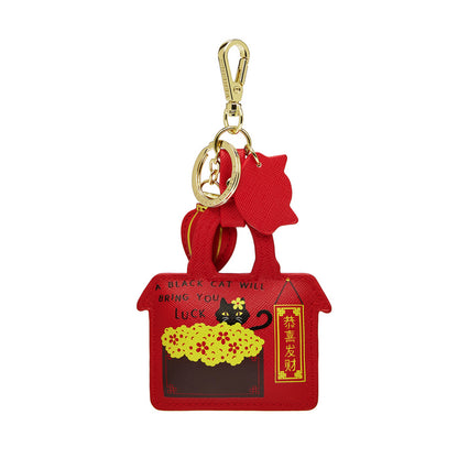 Red cat-shaped keychain with gold clasp on a white background