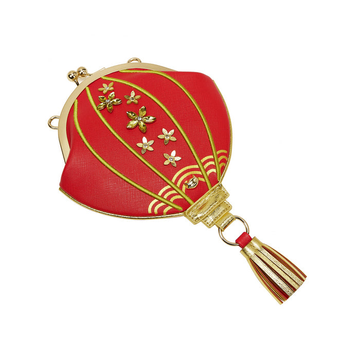 Red and gold hot air balloon-shaped pouch with tassel on a white background