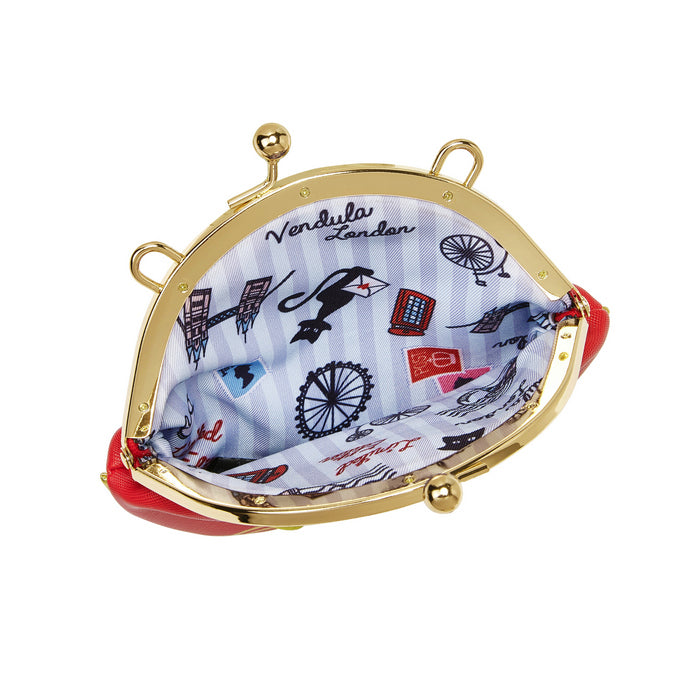 Round clutch bag with gold frame and red interior, featuring London-themed design.