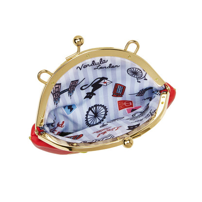 Round clutch bag with gold frame and red interior, featuring London-themed design.