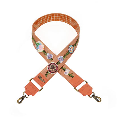 Floral patterned strap with decorative elements on a white background