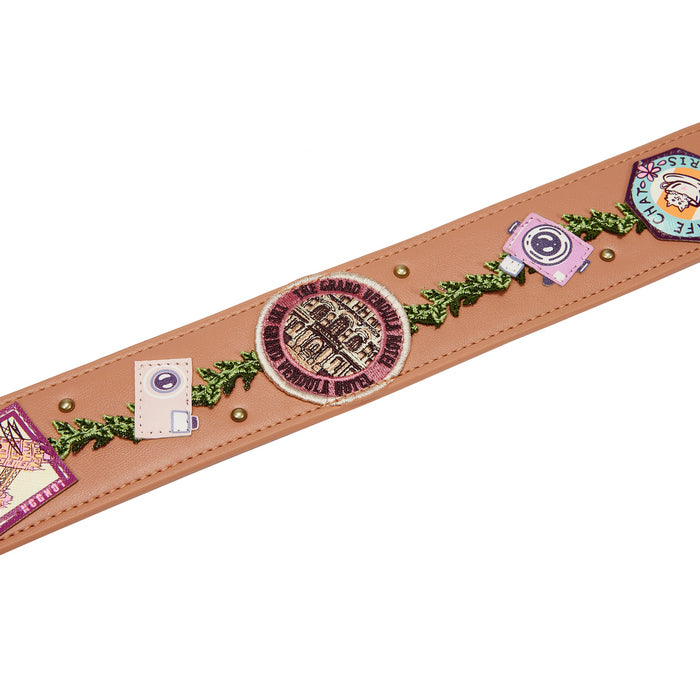 Leather belt with decorative elements on a white background