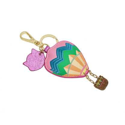 Colorful keychain with heart-shaped pouch and various charms on a white background