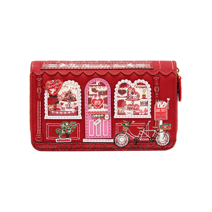 Red wallet with decorative designs on a white background