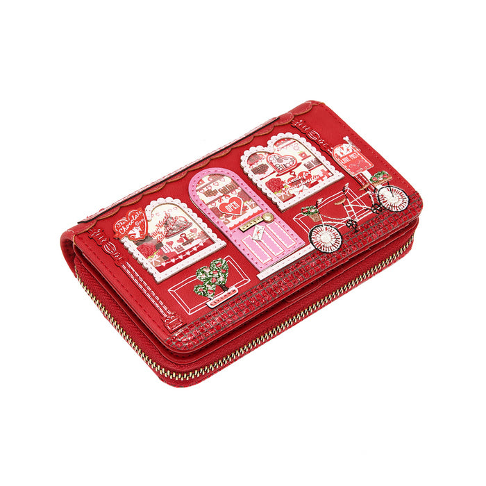 Red wallet with decorative designs on a white background