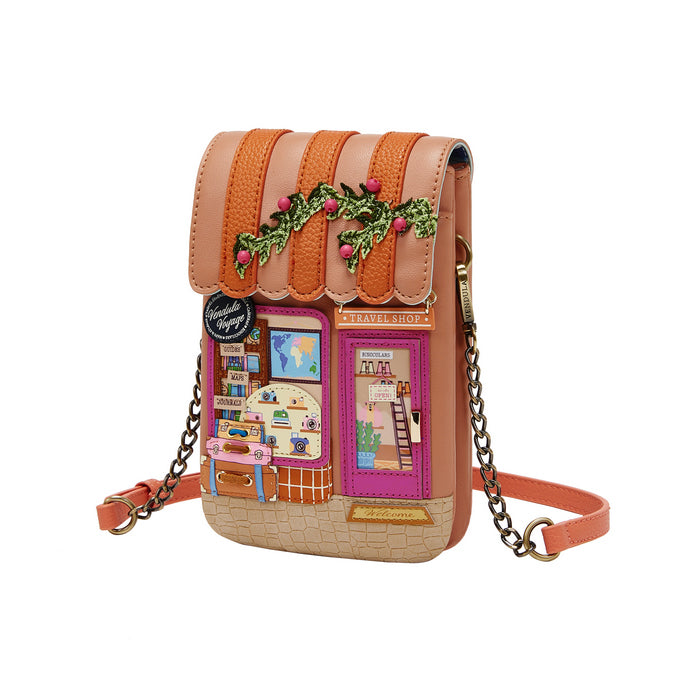 Handbag designed like a small house with a door and windows on a white background