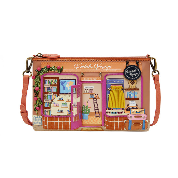 Crossbody bag with a design of a store interior and 'Vendula Voyage' branding.