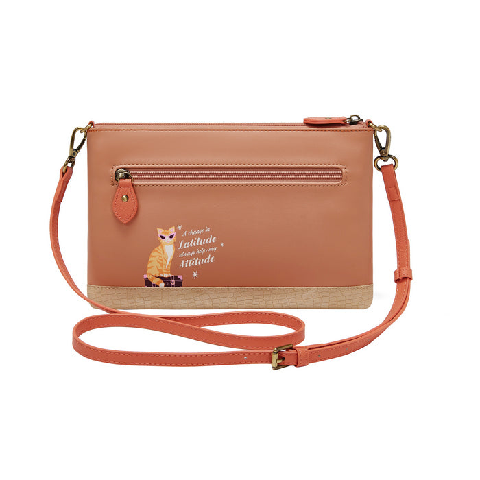 Coral crossbody bag with a fox design and text on a white background