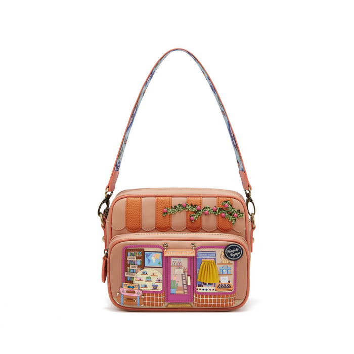 Crossbody bag with store window design on a white background