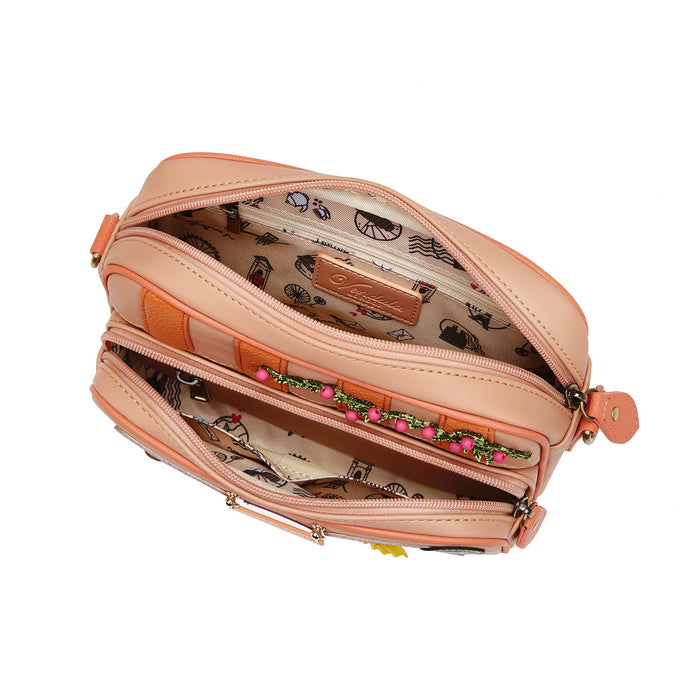 Open peach-colored handbag with floral pattern on a white background