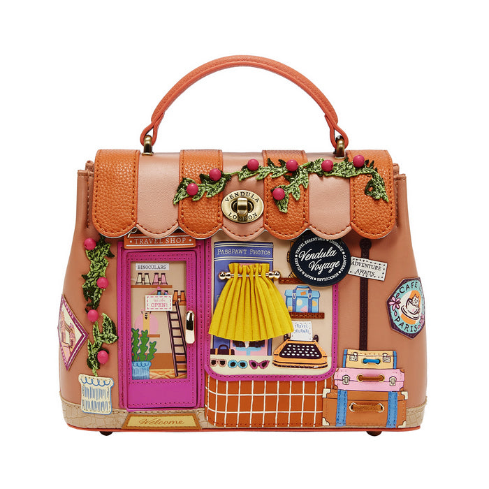 Colorful handbag with decorative elements on a white background