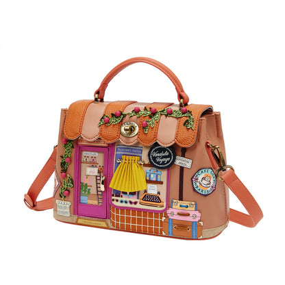 Decorative handbag with colorful patches and a handle on a white background
