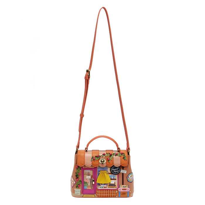 Decorative handbag with a collage of images on a white background