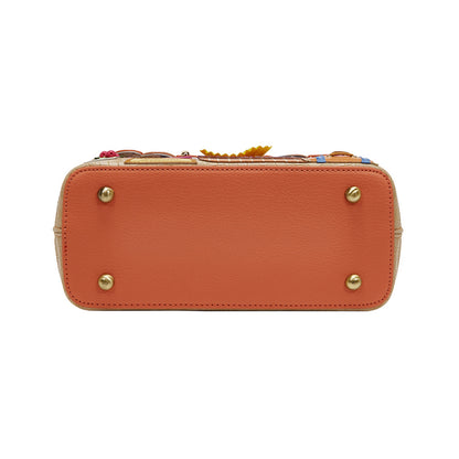 Orange handbag with decorative elements on a white background