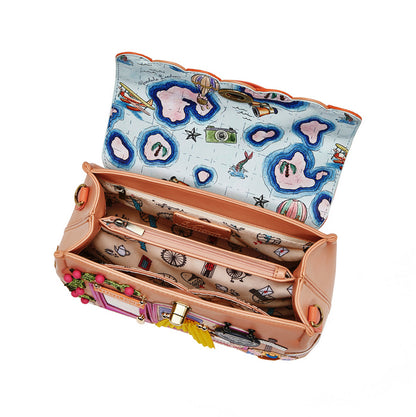 Colorful handbag with a patterned interior on a white background