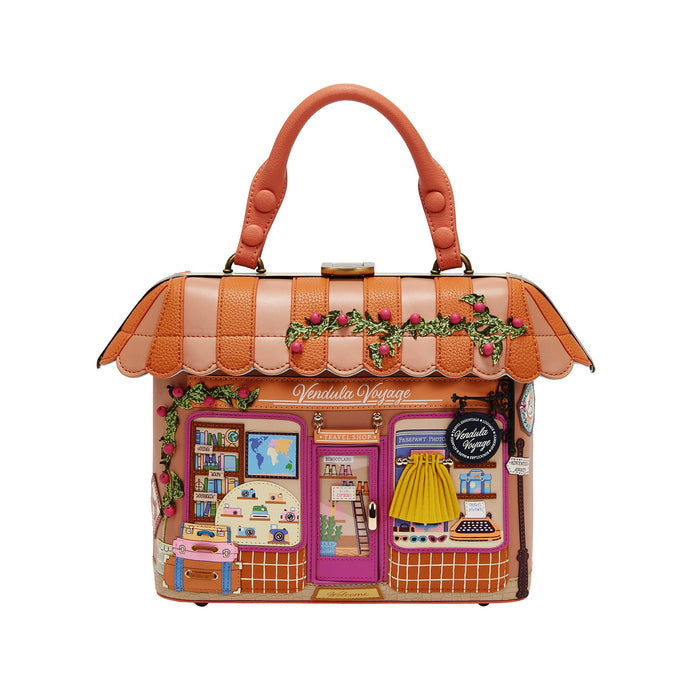 Handbag designed like a vintage store with a colorful facade on a white background