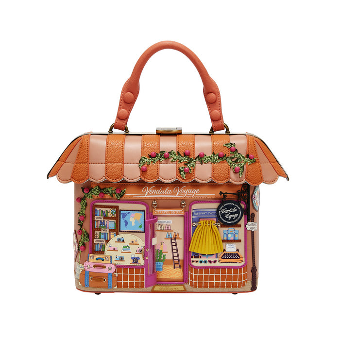 Handbag designed like a miniature store with a colorful facade on a white background