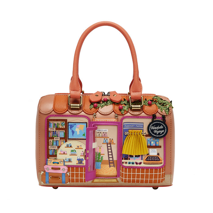 Decorative handbag with a miniature scene on a white background