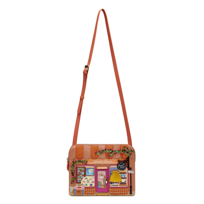 Crossbody bag with a store front design on a white background