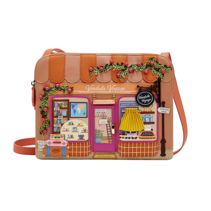 Crossbody bag with a store front design on a white background