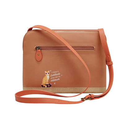 Brown crossbody bag with a cat illustration and text on a white background