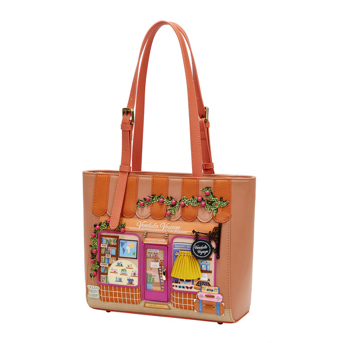 Tan tote bag with a detailed design of a store front on a white background