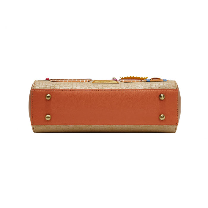 Orange and beige handbag with gold accents on a white background