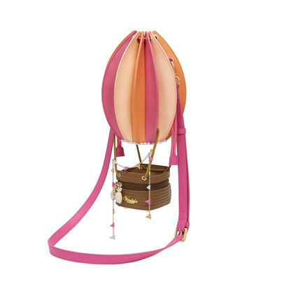 Colorful hot air balloon-shaped bag with pink straps on a white background
