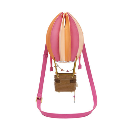 Colorful hot air balloon-shaped bag with a pink strap on a white background