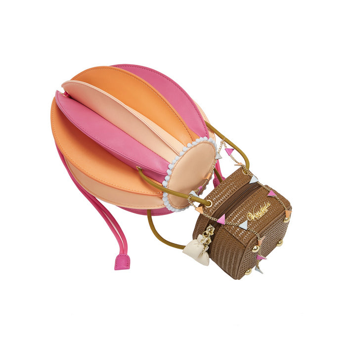 Colorful hot air balloon-shaped pouch with a small brown bag attached on a white background