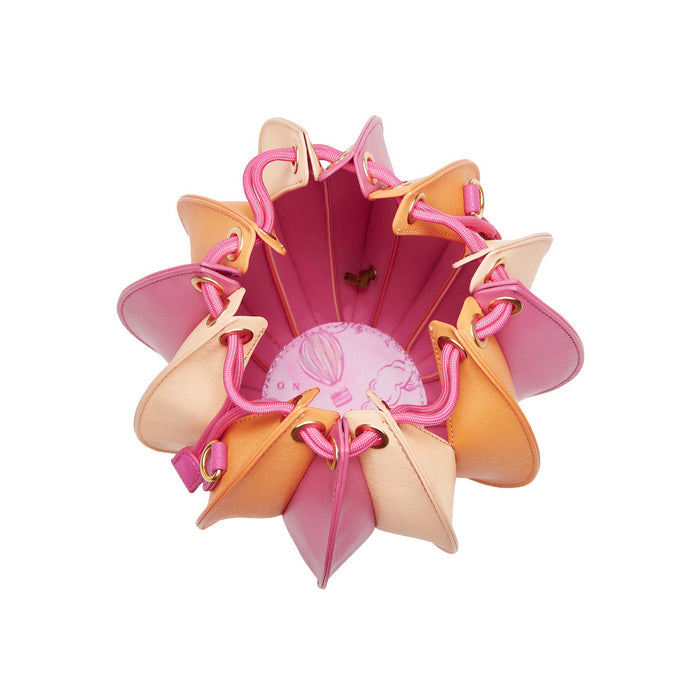 Colorful shoe organizer with pink, orange, and peach shoes on a white background