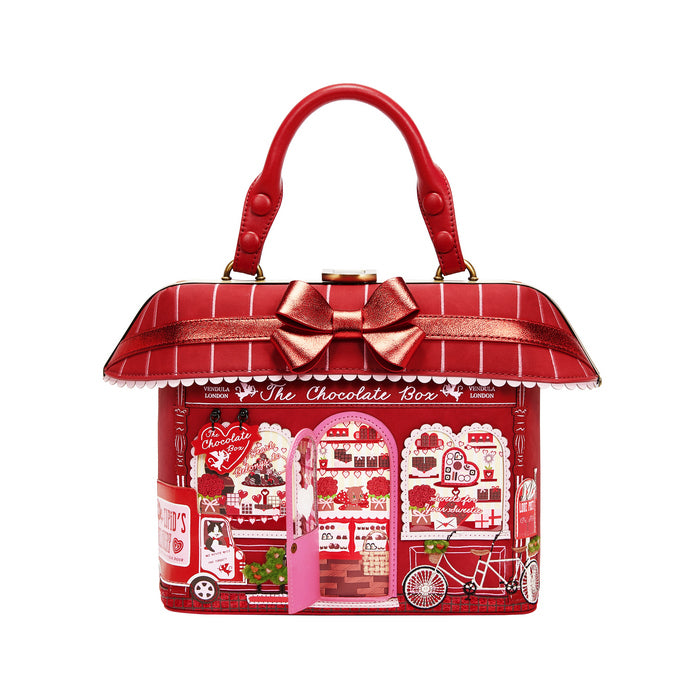 Red chocolate-themed handbag with a bow on a white background