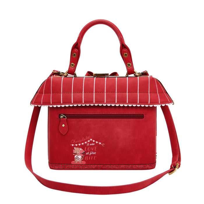 Red checkered handbag with a decorative strap on a white background