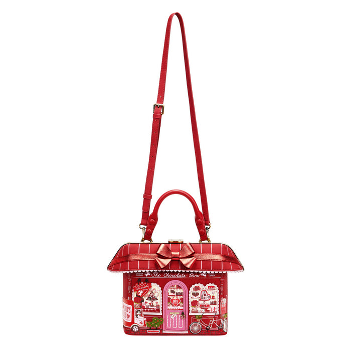Red handbag with a detailed design on a white background
