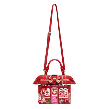 Red handbag with a detailed design on a white background
