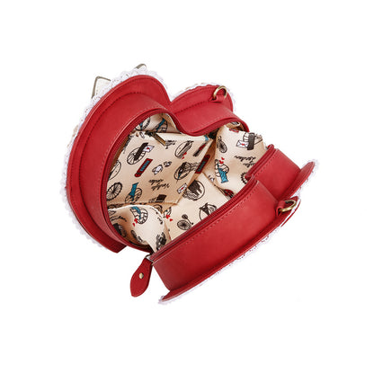 Red handbag with patterned interior on a white background