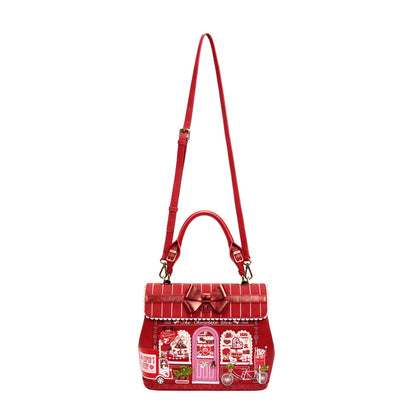 Red handbag with a detailed design on a white background