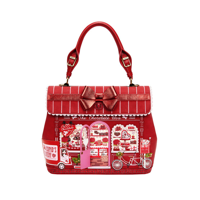 Red handbag with decorative elements on a white background