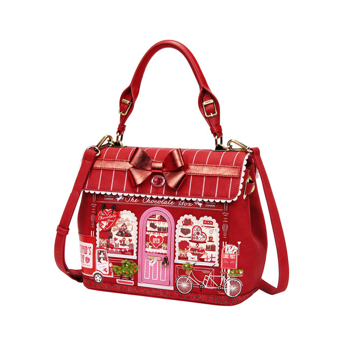 Red handbag with a detailed design on a white background
