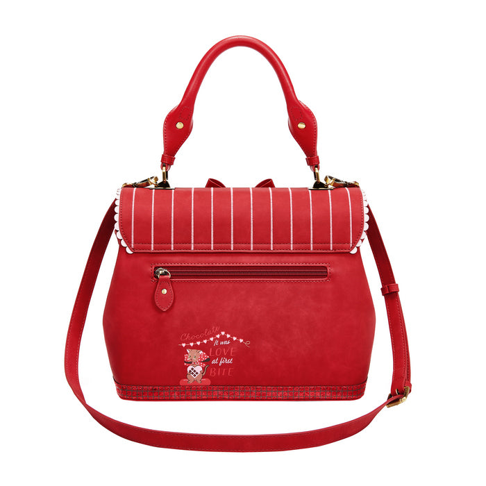 Red handbag with a decorative design on a white background