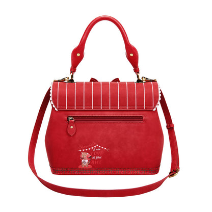 Red handbag with a decorative design on a white background