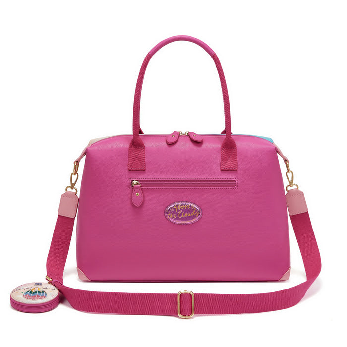 Pink handbag with a strap on a white background