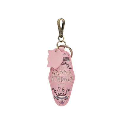 Pink keychain with 'The Grand Vendula Hotel 56' text on a white background